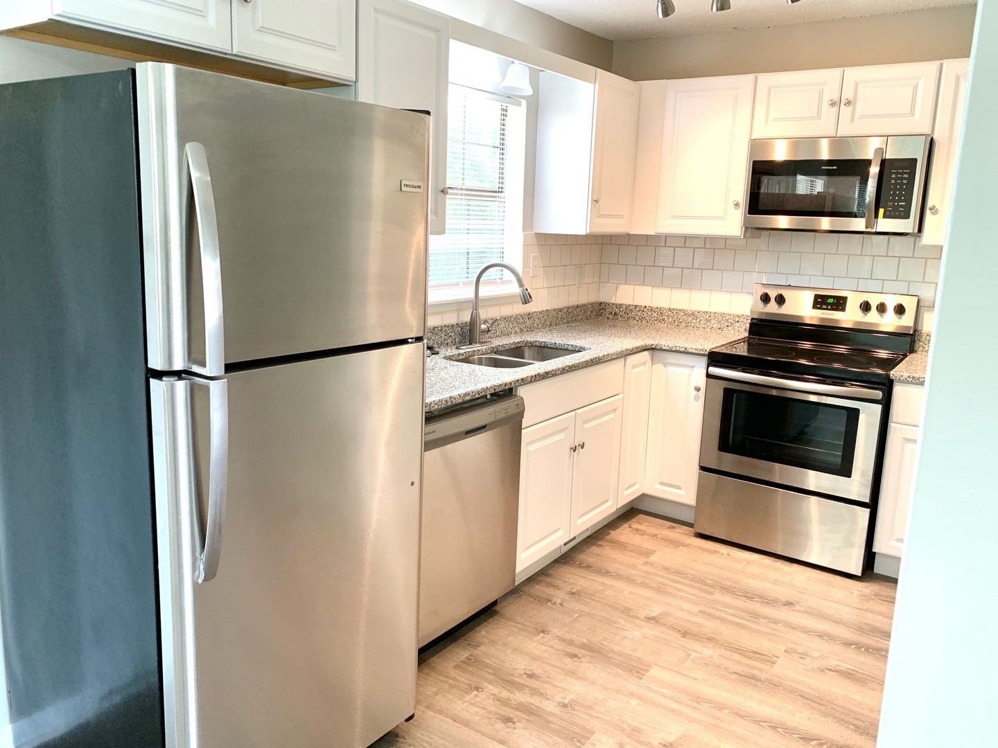 208 State Line Road Clarksville, TN 37042 - Photo 8 of 23 a kitchen with stainless steel appliances a refrigerator sink and microwave
