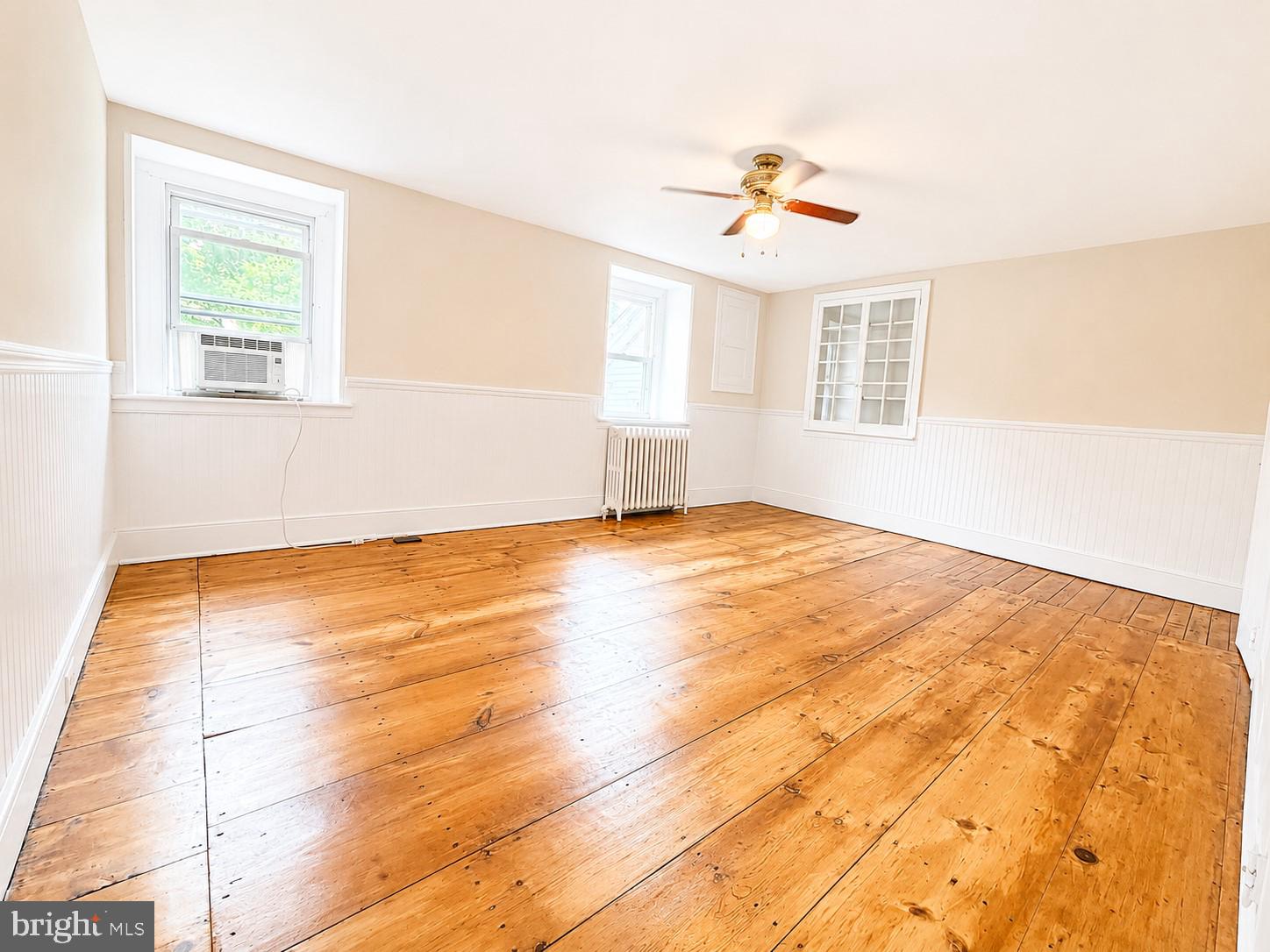 34 Fretz Road Perkasie, PA 18944 - Photo 15 of 24 a view of empty room with wooden floor and fan