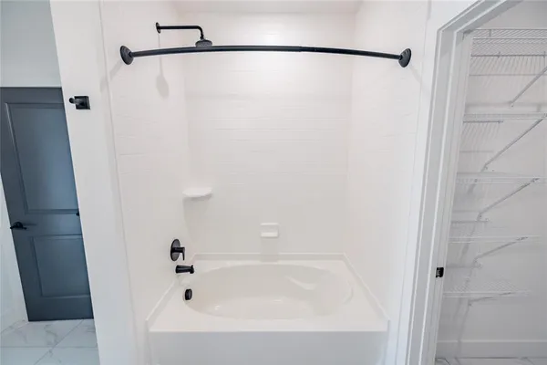 a bathroom with a bathtub