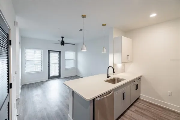 a kitchen with a sink and window