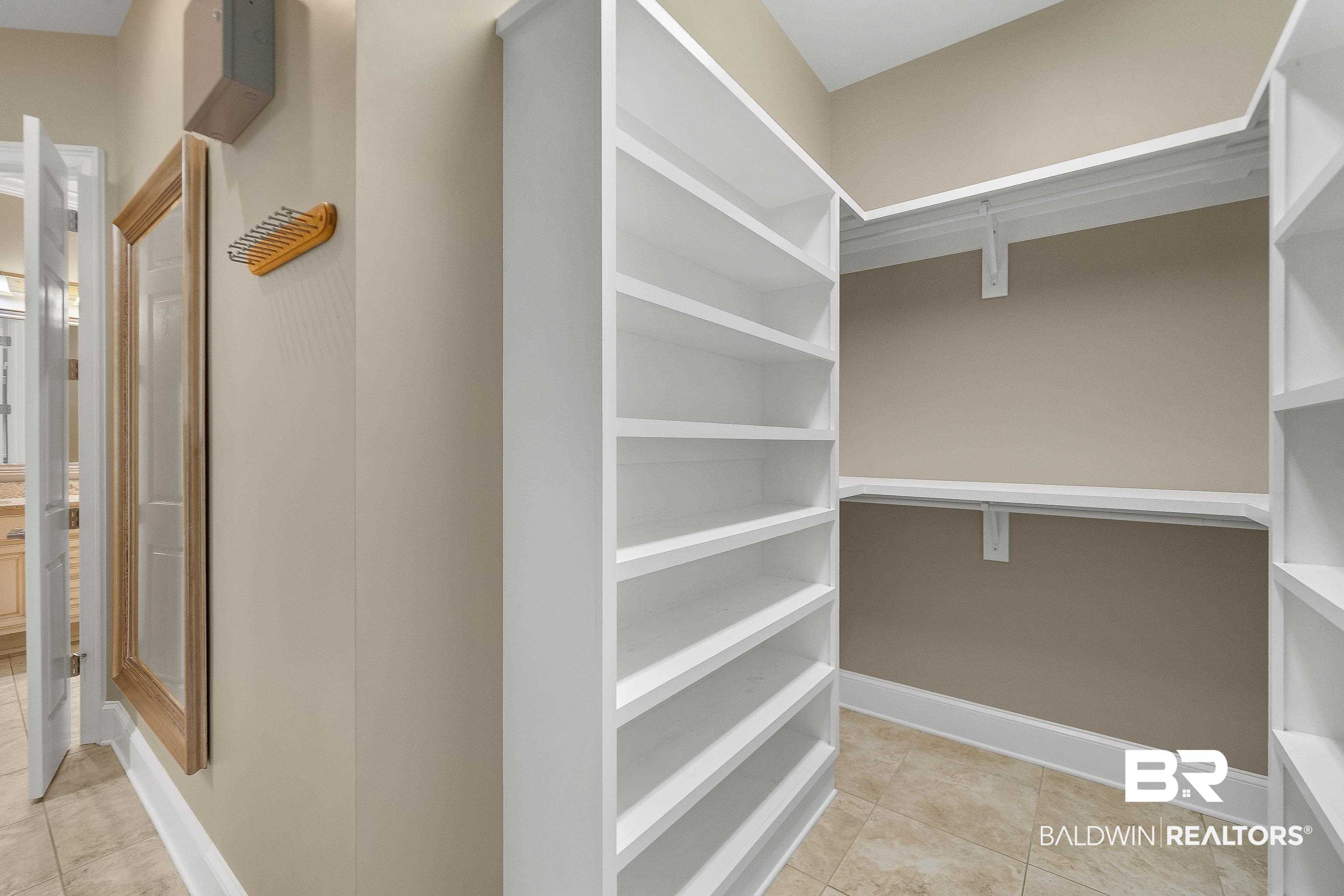 17663 Burwick Loop Fairhope, AL 36532 - Photo 30 of 41 Walk in closet featuring light tile patterned flooring