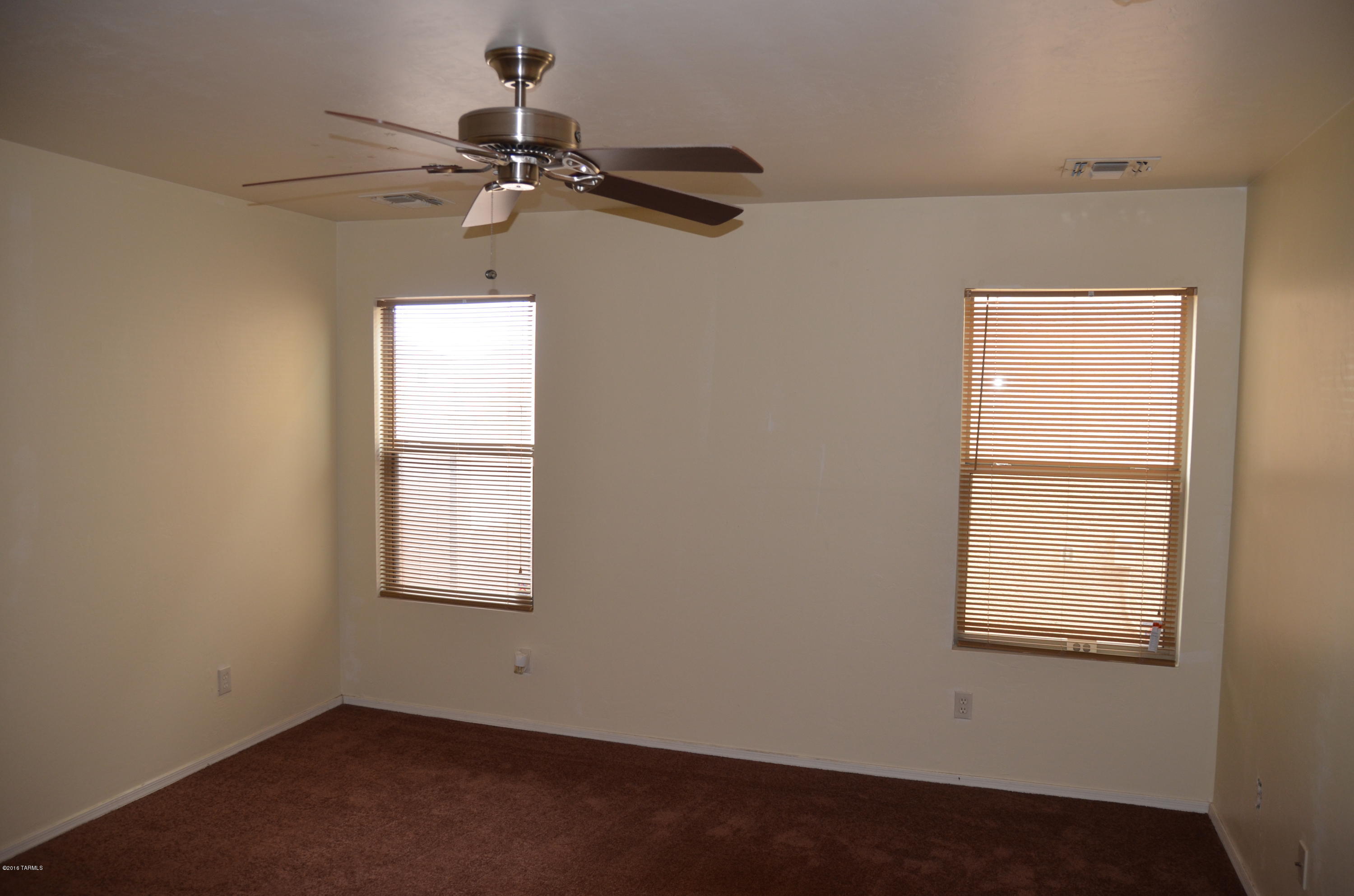 698 West Ash Ridge Drive Green Valley, AZ 85614 - Photo 13 of 19 an empty room with a window