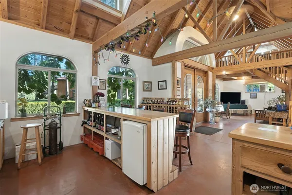 a open kitchen with stainless steel appliances granite countertop a stove and a refrigerator