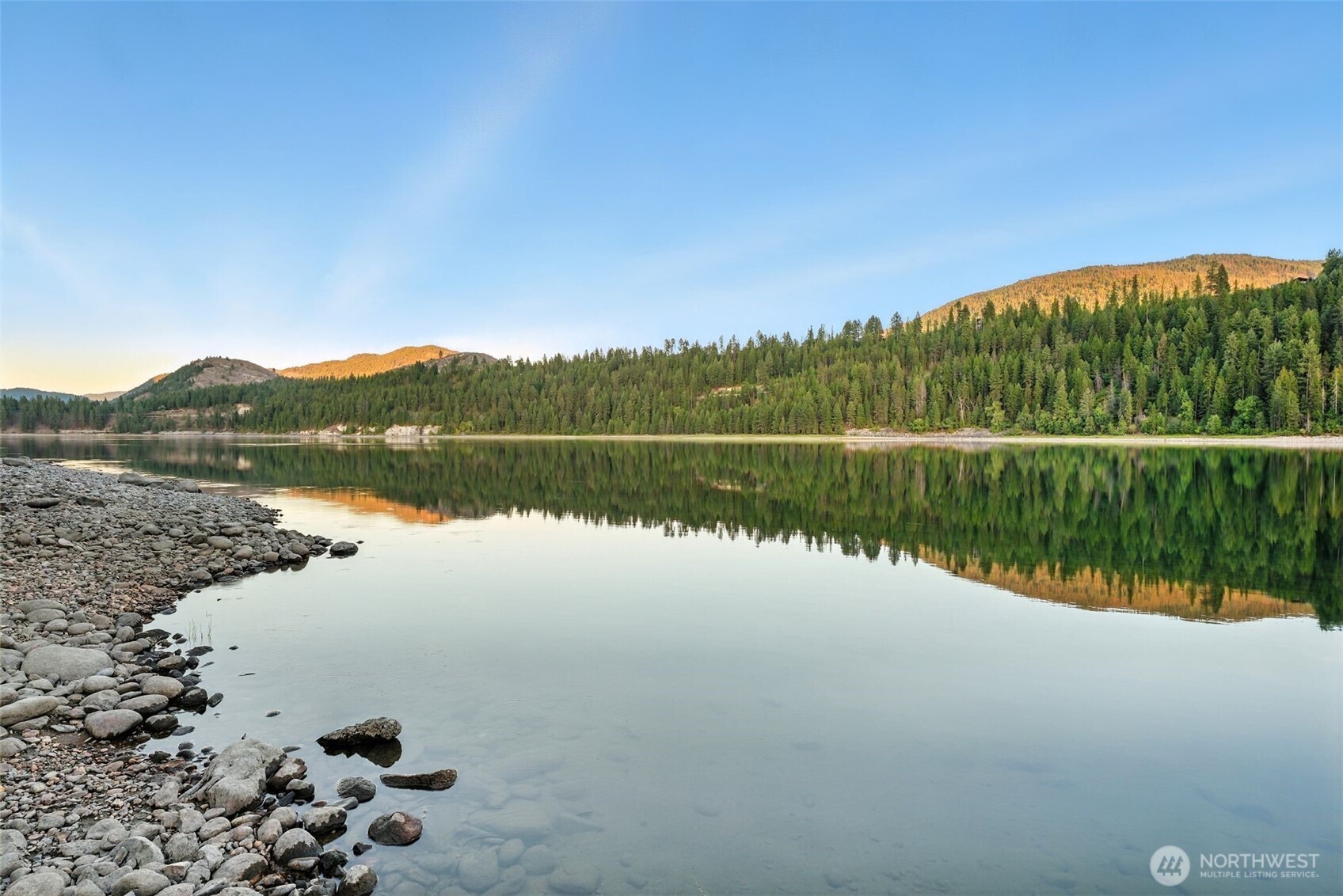 3725 Vineyard Way Kettle Falls, WA 99141 - Photo 35 of 40 a view of a lake with a mountain in the background