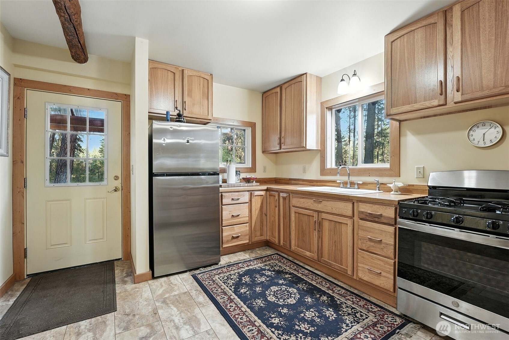 3725 Vineyard Way Kettle Falls, WA 99141 - Photo 6 of 40 a kitchen with a refrigerator stove and sink