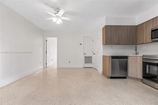 a view of a kitchen with a sink and a stove