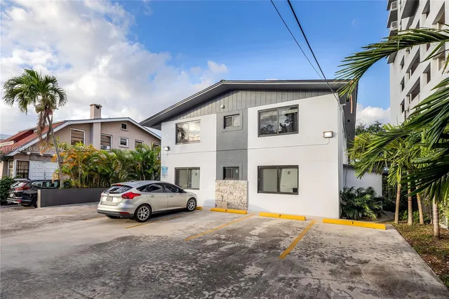 a building with trees in front of it