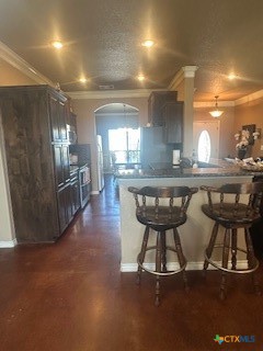 629 River Road Gatesville, TX 76528 - Photo 15 of 37 a kitchen with stainless steel appliances a dining table chairs and granite counter tops