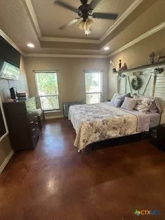 a spacious bedroom with a bed and couch
