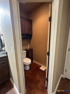629 River Road Gatesville, TX 76528 - Photo 22 of 37 a bathroom with a granite countertop toilet and a sink