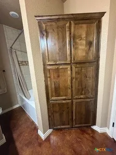 a view of swimming pool with table and chairs under an umbrella