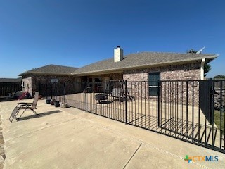 629 River Road Gatesville, TX 76528 - Photo 32 of 37 a view of a house with large windows and wooden fence
