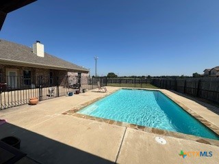629 River Road Gatesville, TX 76528 - Photo 36 of 37 a swimming pool with outdoor seating and yard