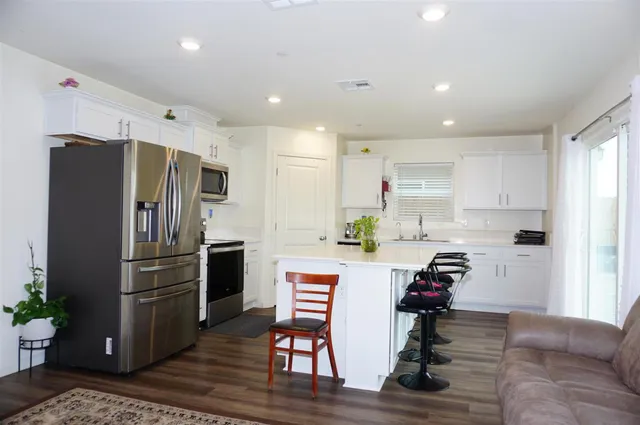 a bedroom with a bed and cabinets