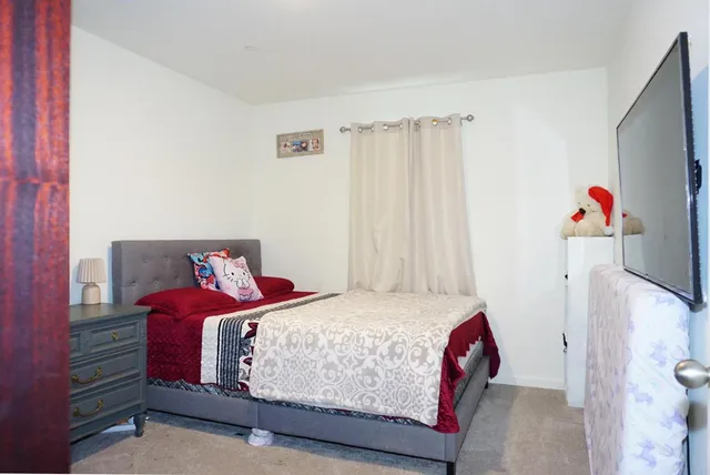 a room with a bed and furniture