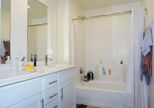 a bedroom with a bed and a cabinets