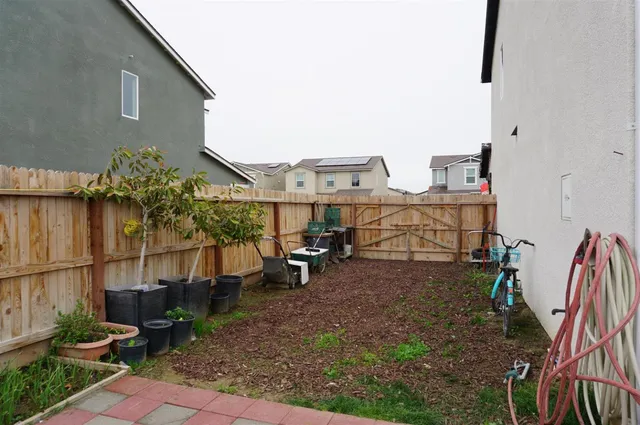 a front view of house with yard and outdoor seating