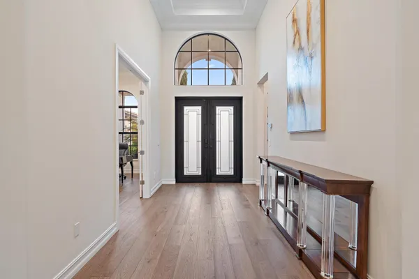 a view of a bathroom with a tub shower and mirror