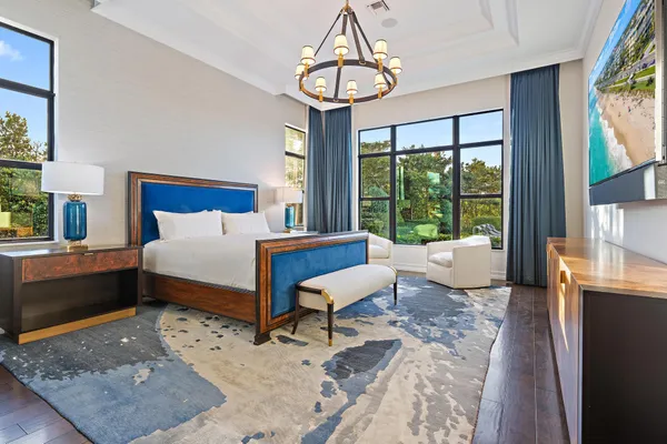 a living room with furniture and a book shelf