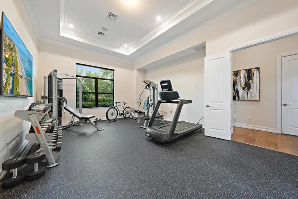 an aerial view of multiple houses with a yard