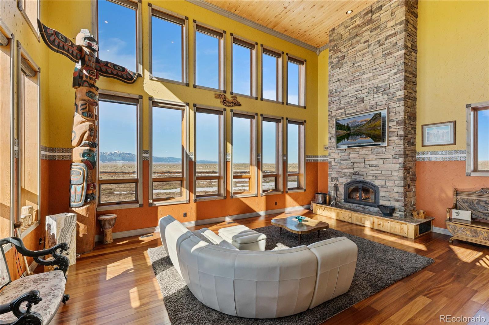 731 County Road 121 Walsenburg, CO 81089 - Photo 12 of 50 a living room with furniture or fireplace and a floor to ceiling window