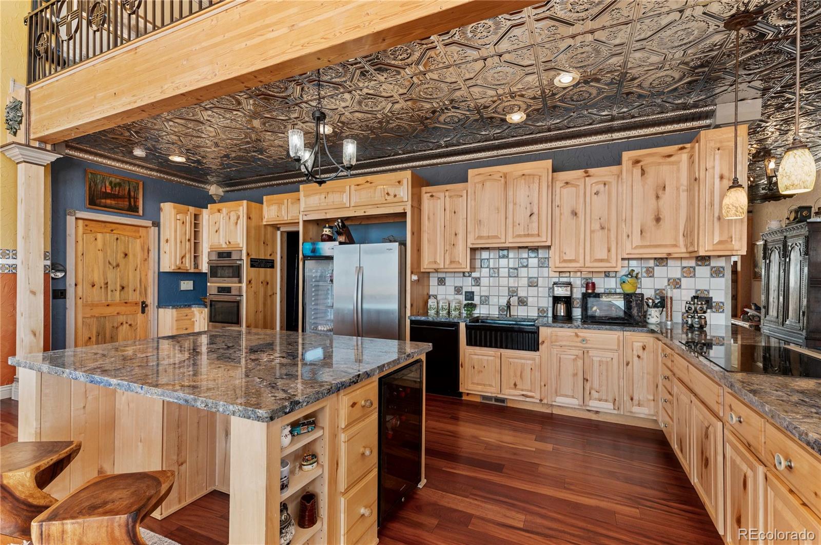 731 County Road 121 Walsenburg, CO 81089 - Photo 17 of 50 a kitchen with stainless steel appliances granite countertop a sink and cabinets