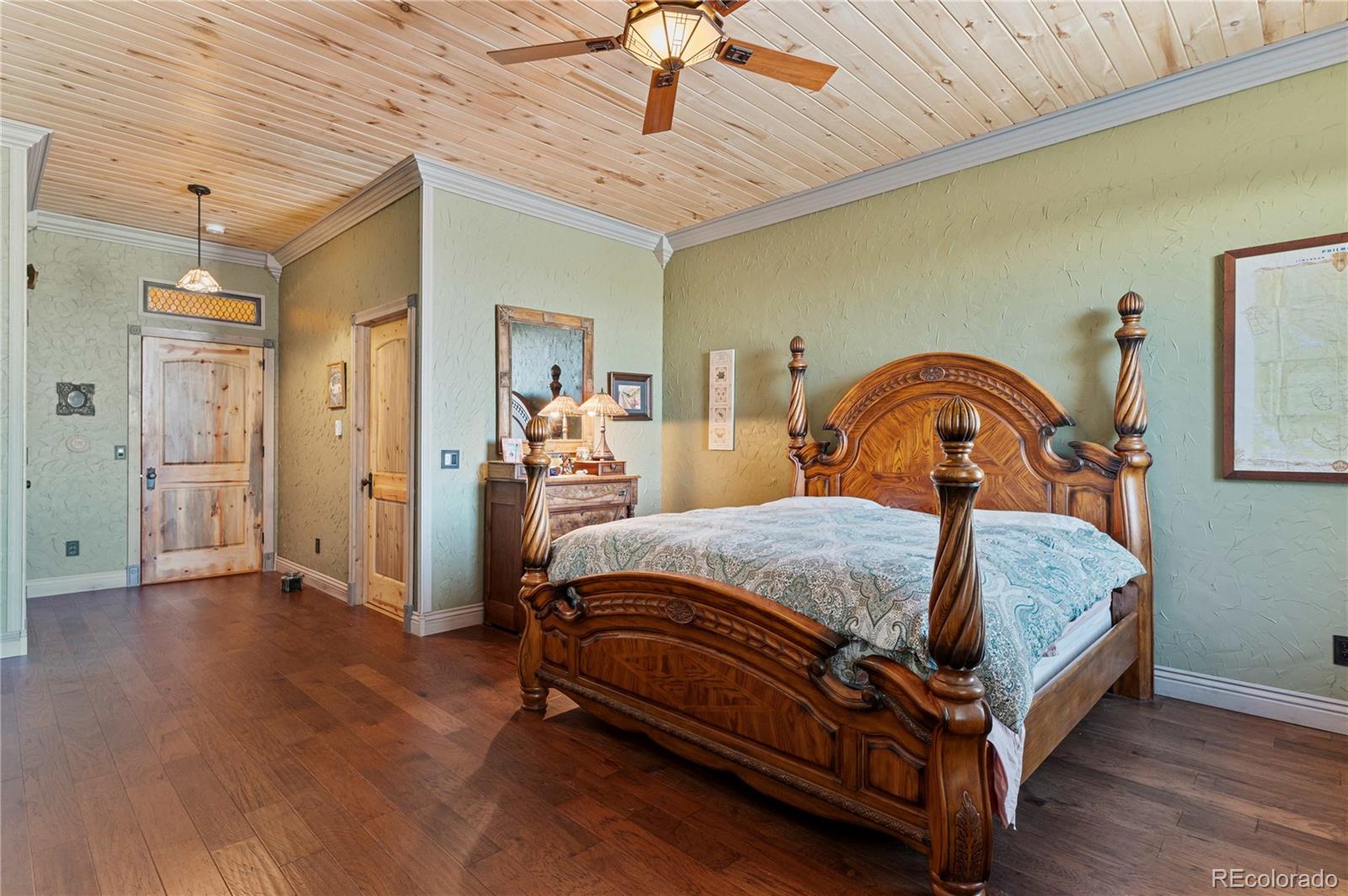 731 County Road 121 Walsenburg, CO 81089 - Photo 20 of 50 a bedroom with a bed and wooden floor