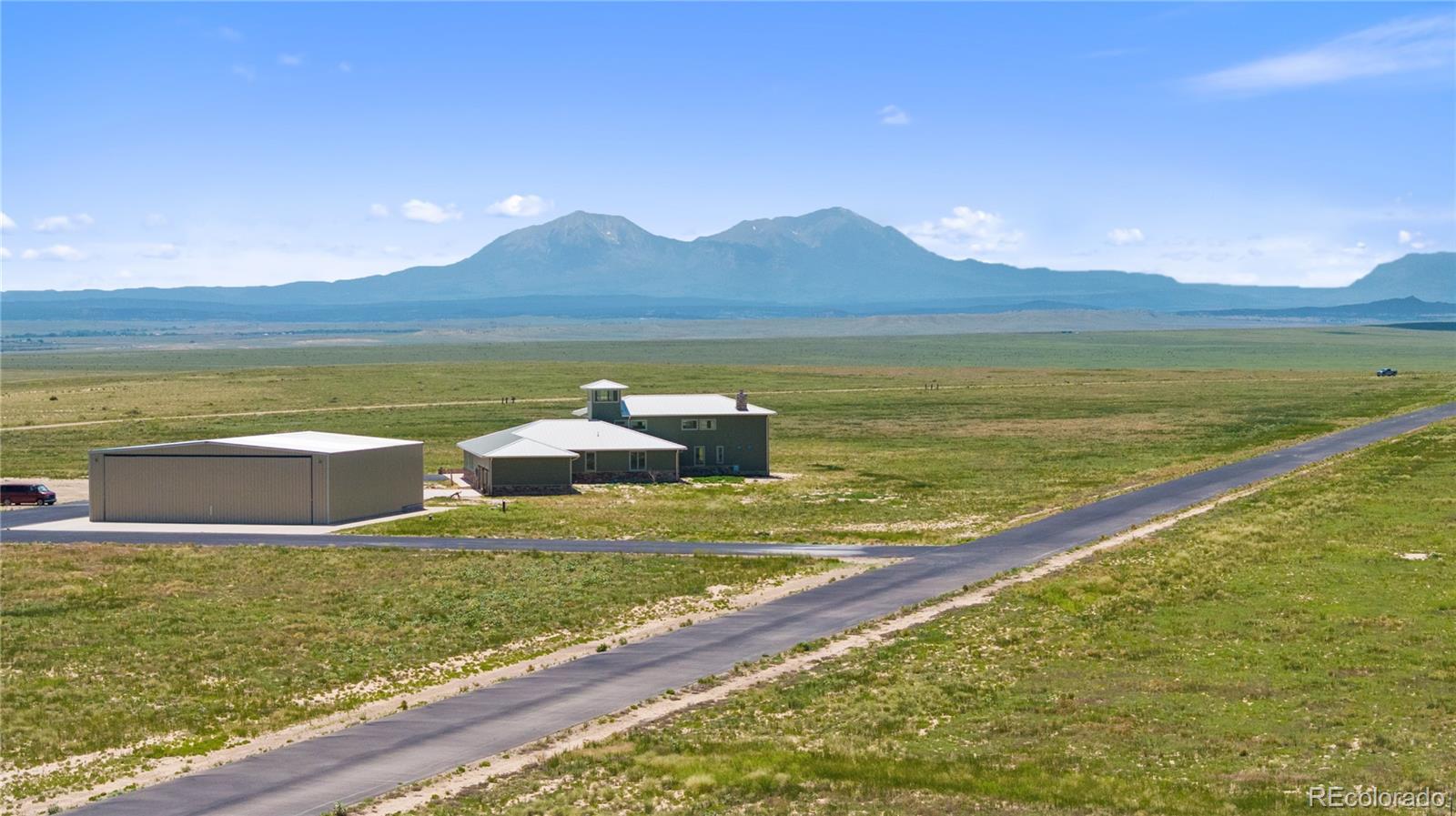 731 County Road 121 Walsenburg, CO 81089 - Photo 2 of 50 a view of a lake with a mountain in the background