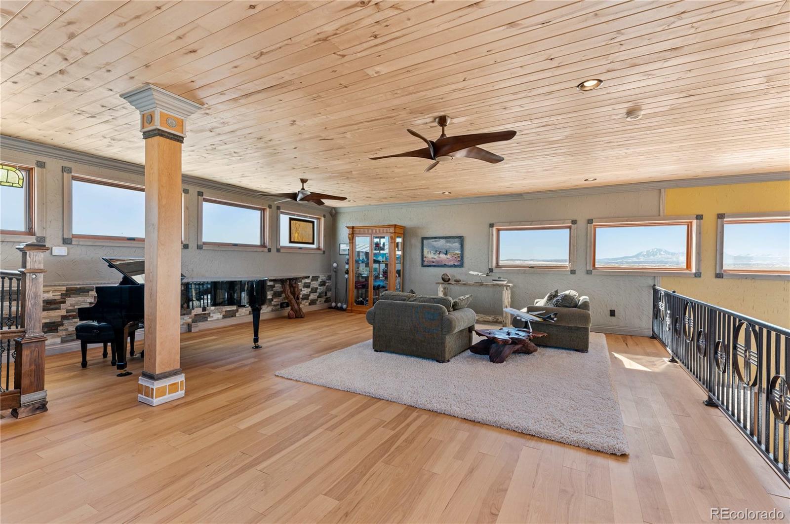 731 County Road 121 Walsenburg, CO 81089 - Photo 30 of 50 a living room with fireplace furniture and a wooden floor
