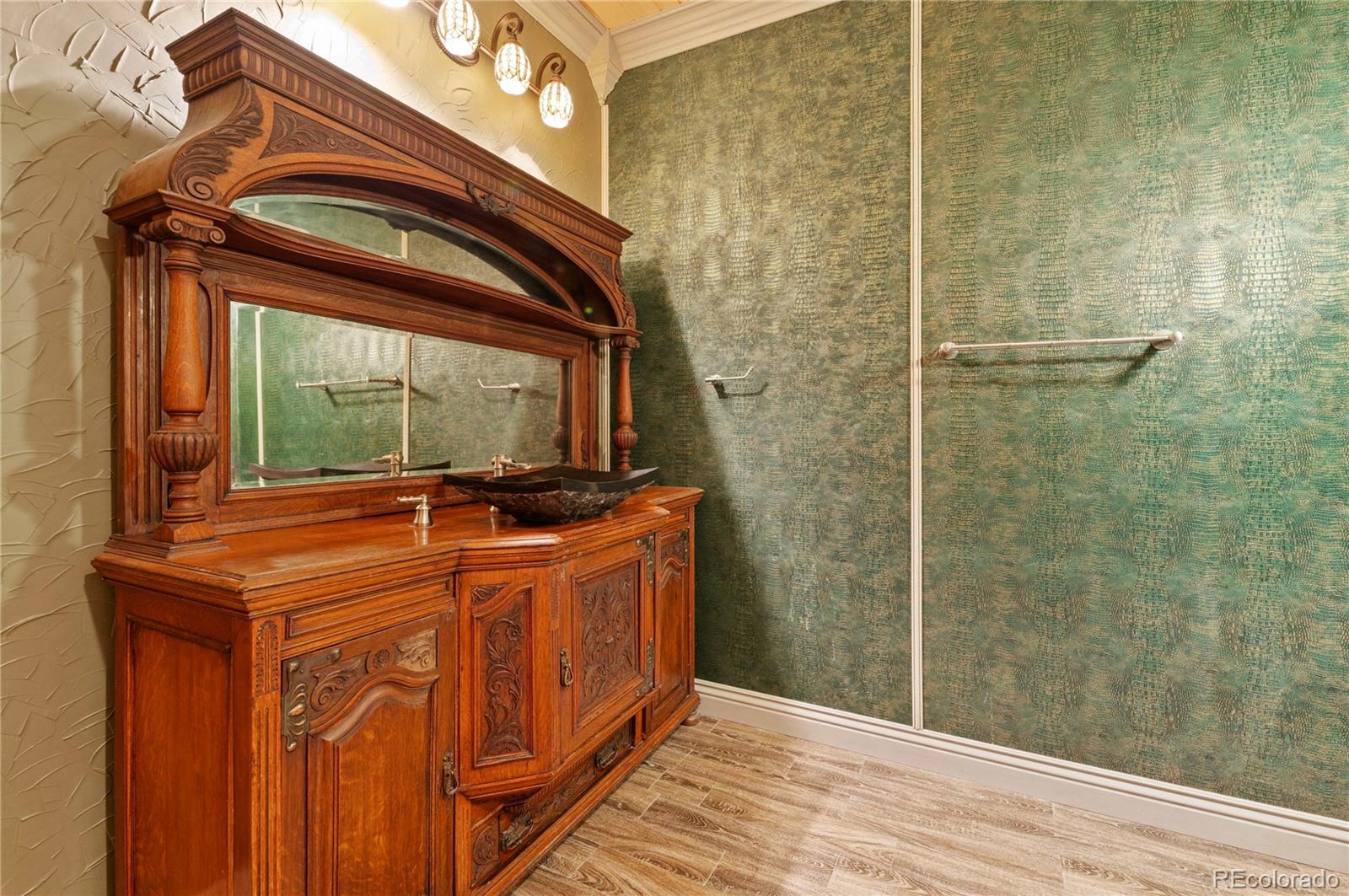 731 County Road 121 Walsenburg, CO 81089 - Photo 35 of 50 a bathroom with a granite countertop sink a mirror and shower