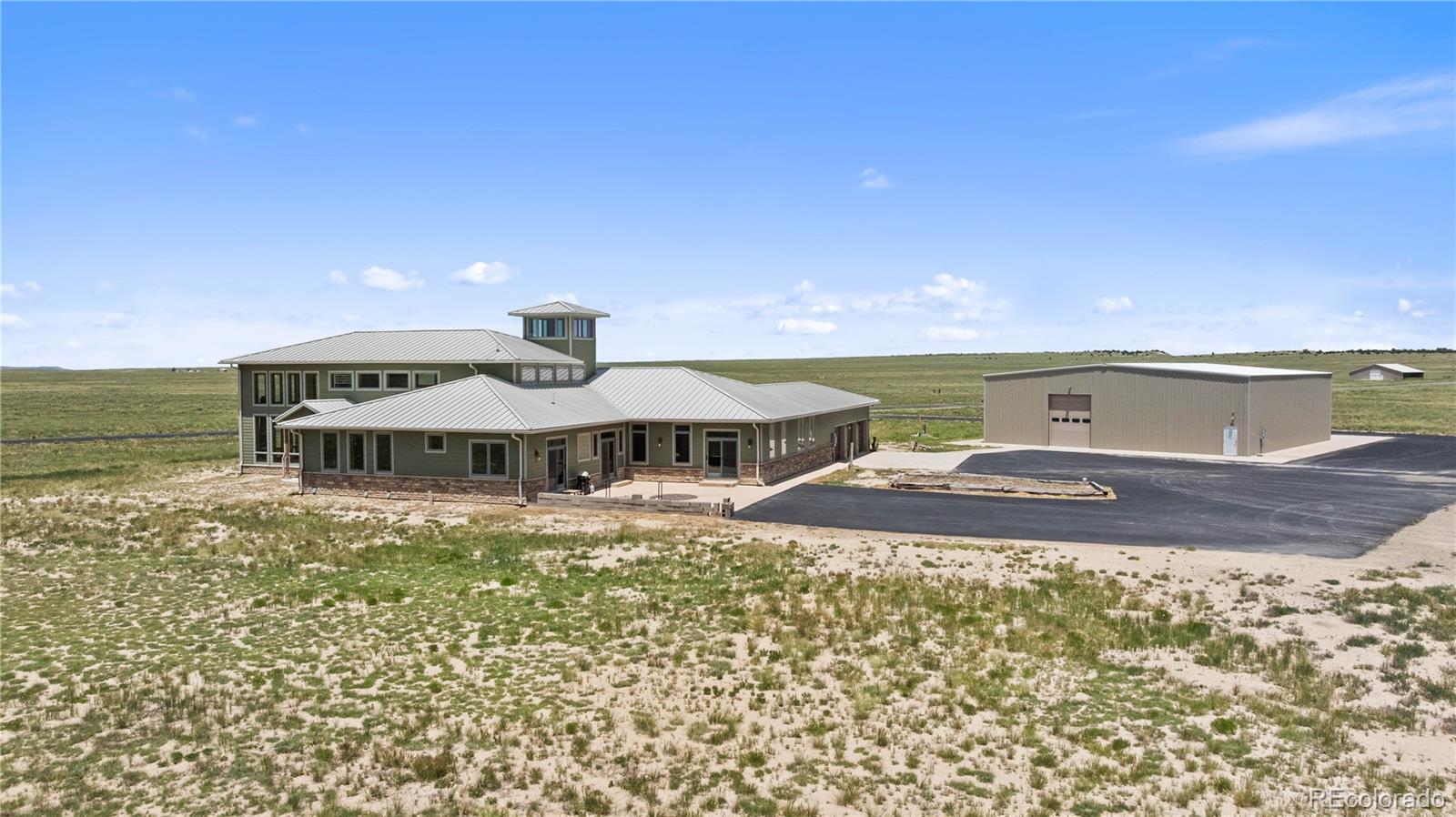 731 County Road 121 Walsenburg, CO 81089 - Photo 5 of 50 a front view of a house with a yard