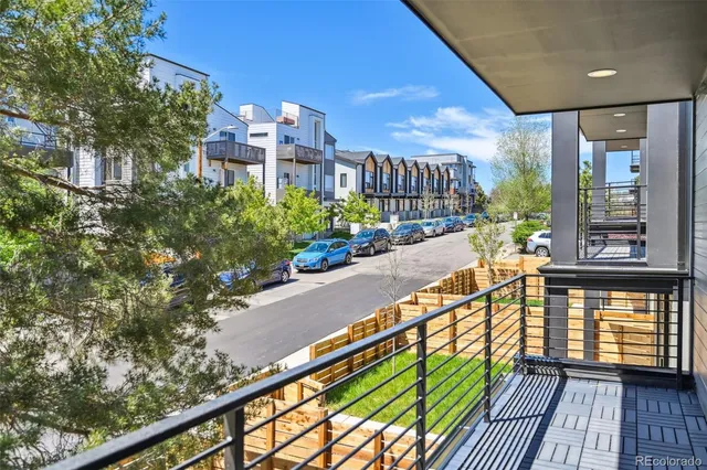 a bathroom with a granite countertop sink a mirror and shower