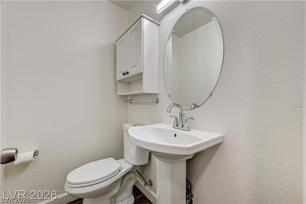 2283 Ramsgate Drive Henderson, NV 89074 - Photo 20 of 51 A classic pedestal sink paired with an oval mirror details this functional powder room.