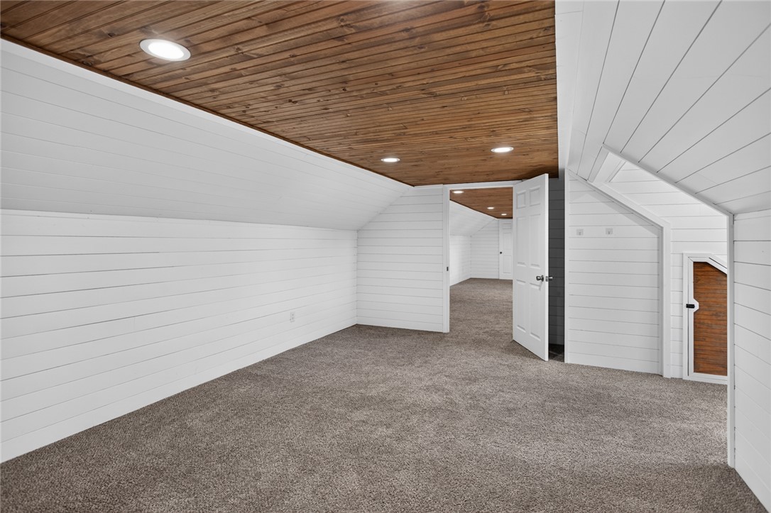 564 Fairfield Road Walhalla, SC 29691 - Photo 32 of 50 Rich wood plank ceilings and shiplap walls elevate this cozy finished attic space.