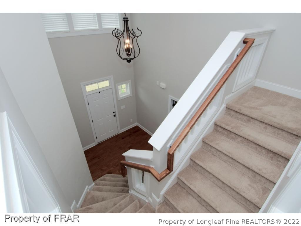 105 Caulfield Road Aberdeen, NC 28315 - Photo 16 of 36 a view of entryway and hall with wooden floor
