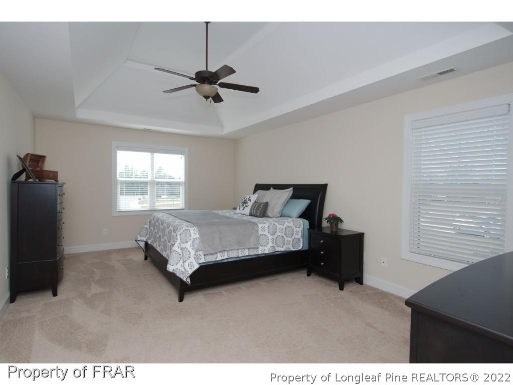 105 Caulfield Road Aberdeen, NC 28315 - Photo 17 of 36 a bedroom with a bed and a window