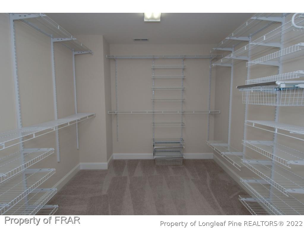 105 Caulfield Road Aberdeen, NC 28315 - Photo 23 of 36 a view of an empty walk in closet