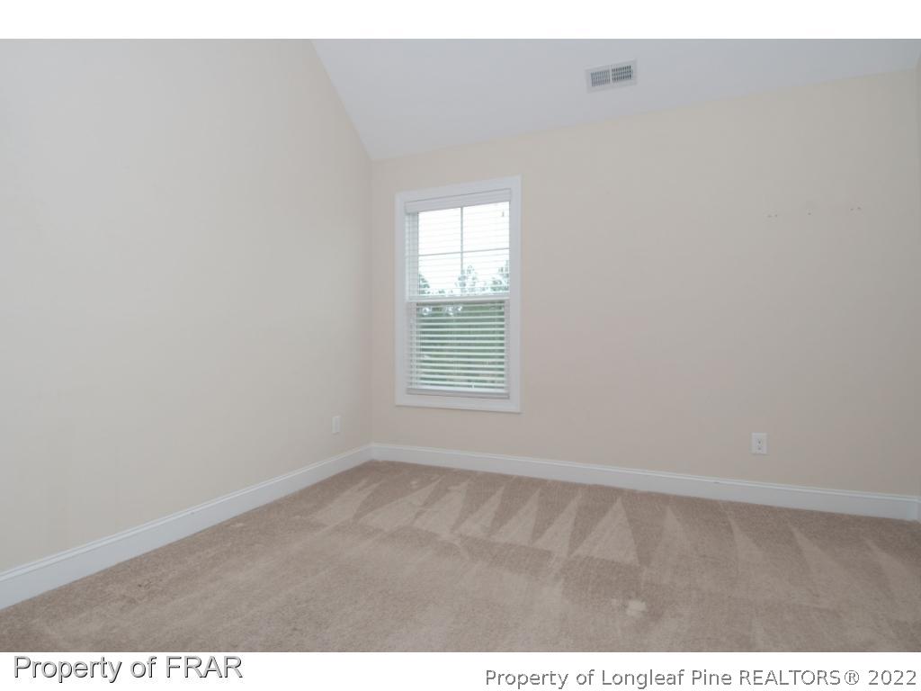 105 Caulfield Road Aberdeen, NC 28315 - Photo 25 of 36 a view of an empty room with a window
