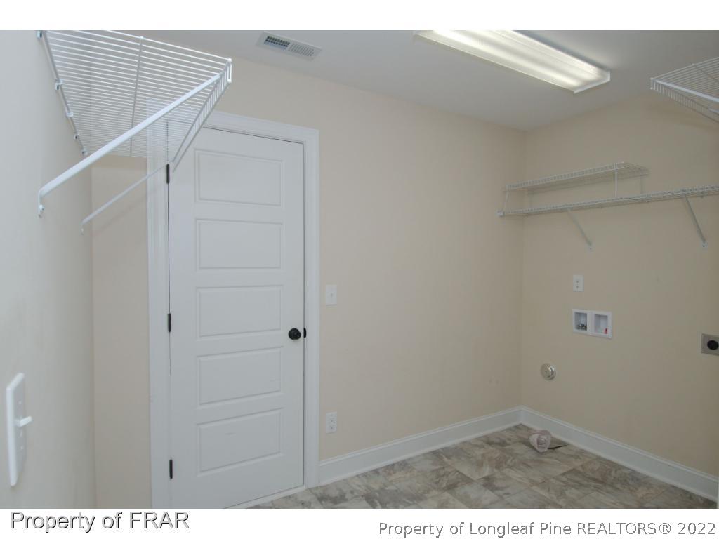 105 Caulfield Road Aberdeen, NC 28315 - Photo 30 of 36 a view of small space with racks on the wall