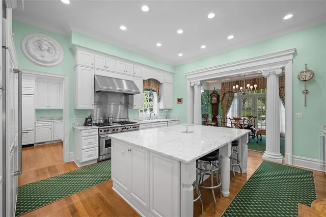 a kitchen with a stove a sink and a refrigerator