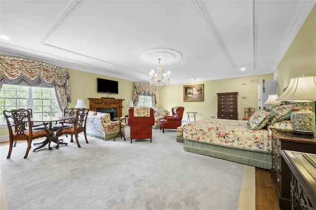 a living room with furniture fireplace and flat screen tv