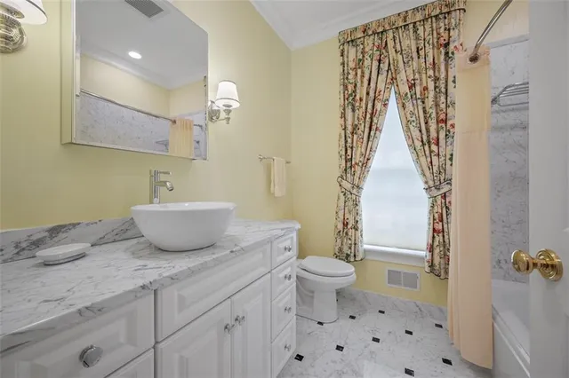 a view of bathroom with a sink and mirror