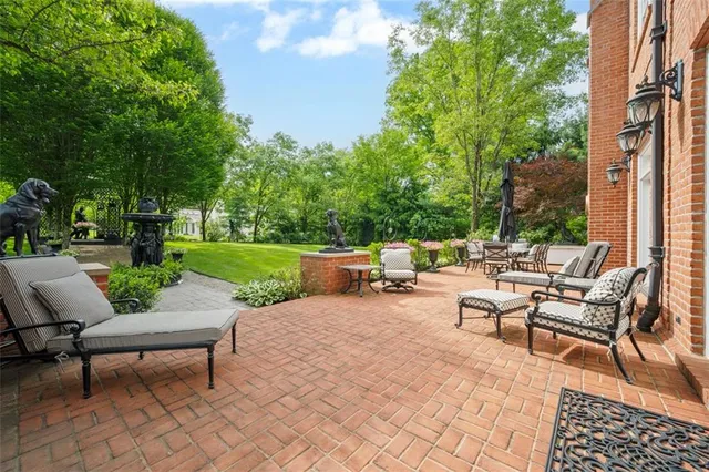 a view of a patio with a table and chairs