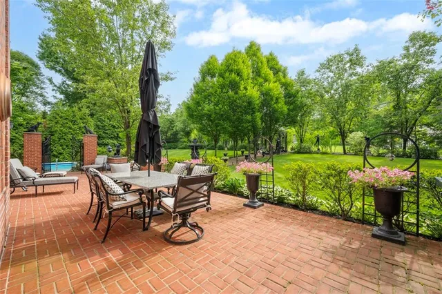 a view of a backyard with sitting area