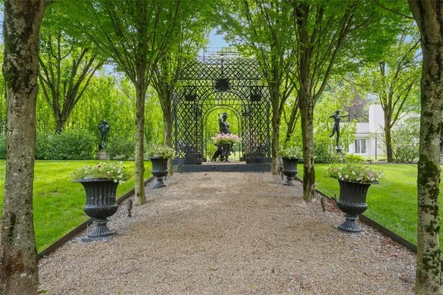 a big yard with lots of green space and trees