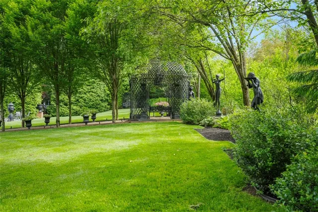 an aerial view of a house with an outdoor space