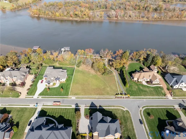 an aerial view of a house with a lake view