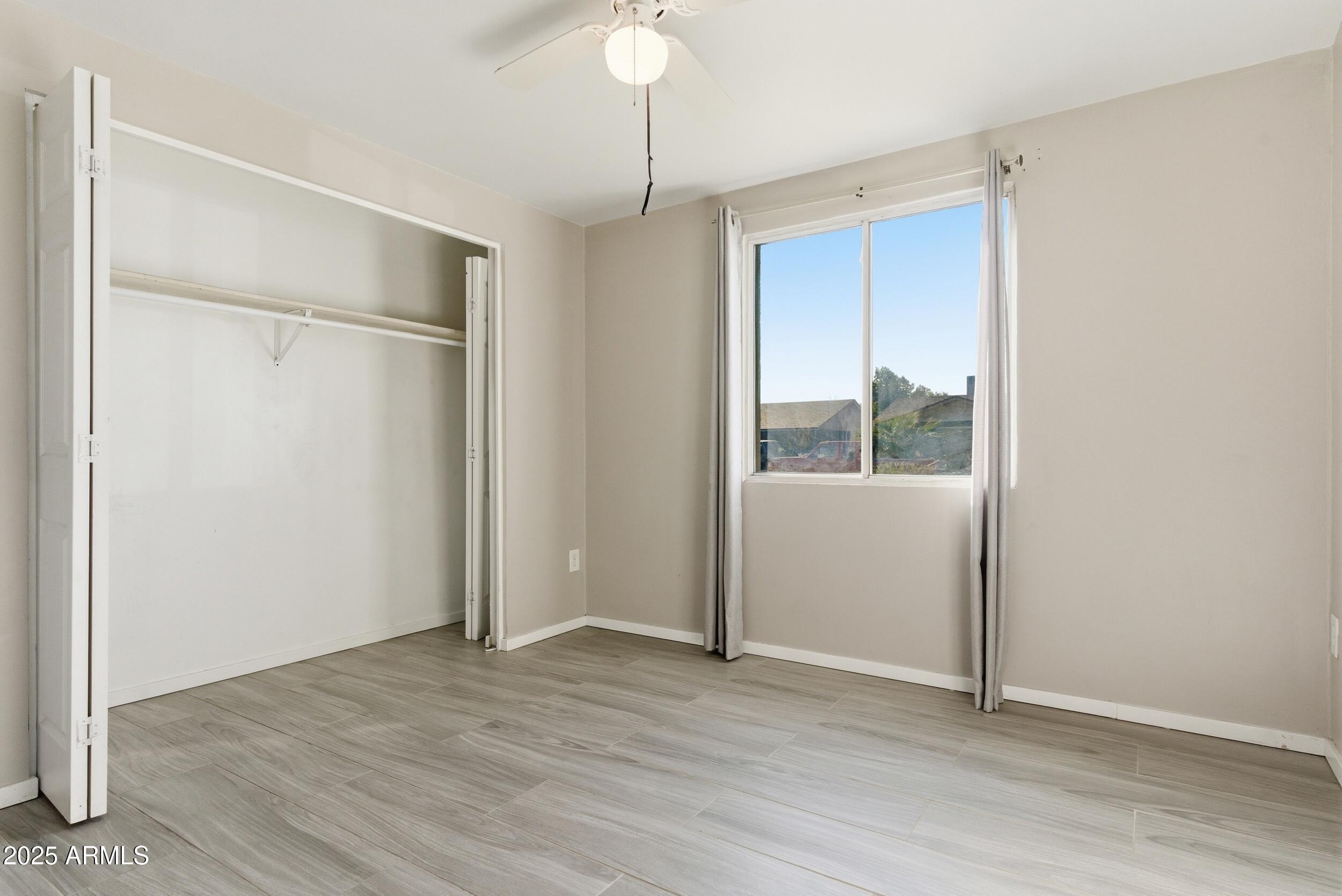7150 West Montecito Avenue Phoenix, AZ 85033 - Photo 17 of 30 a view of an empty room with a window
