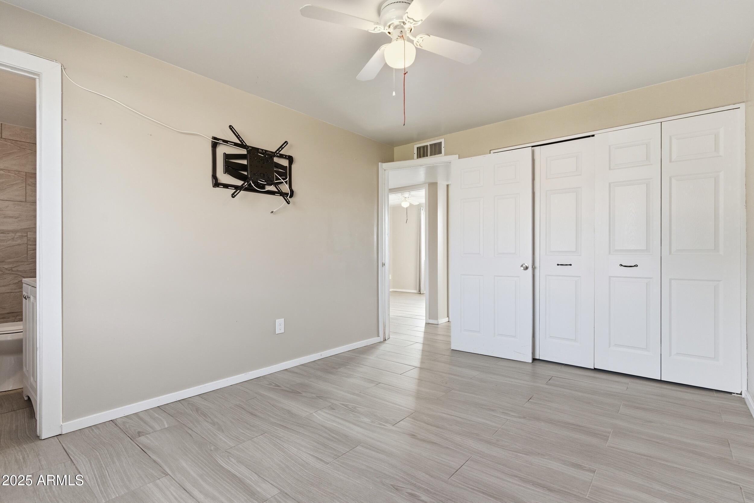 7150 West Montecito Avenue Phoenix, AZ 85033 - Photo 21 of 30 wooden floor in an empty room