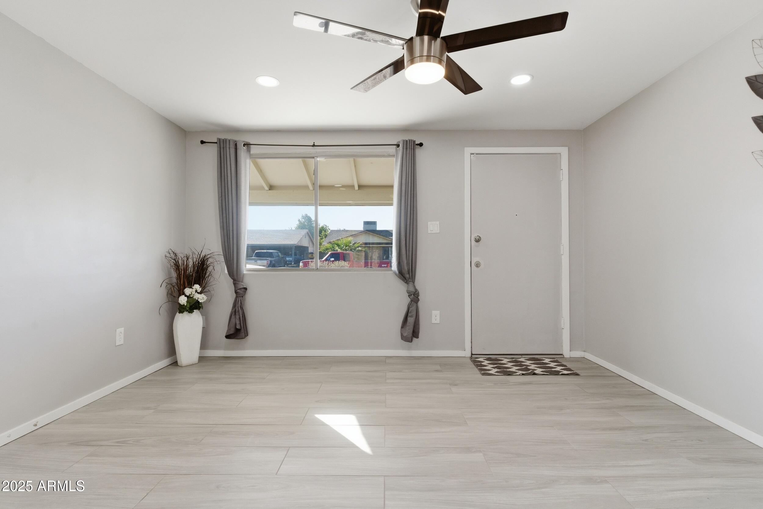 7150 West Montecito Avenue Phoenix, AZ 85033 - Photo 3 of 30 a view of a room with gym equipment and a window